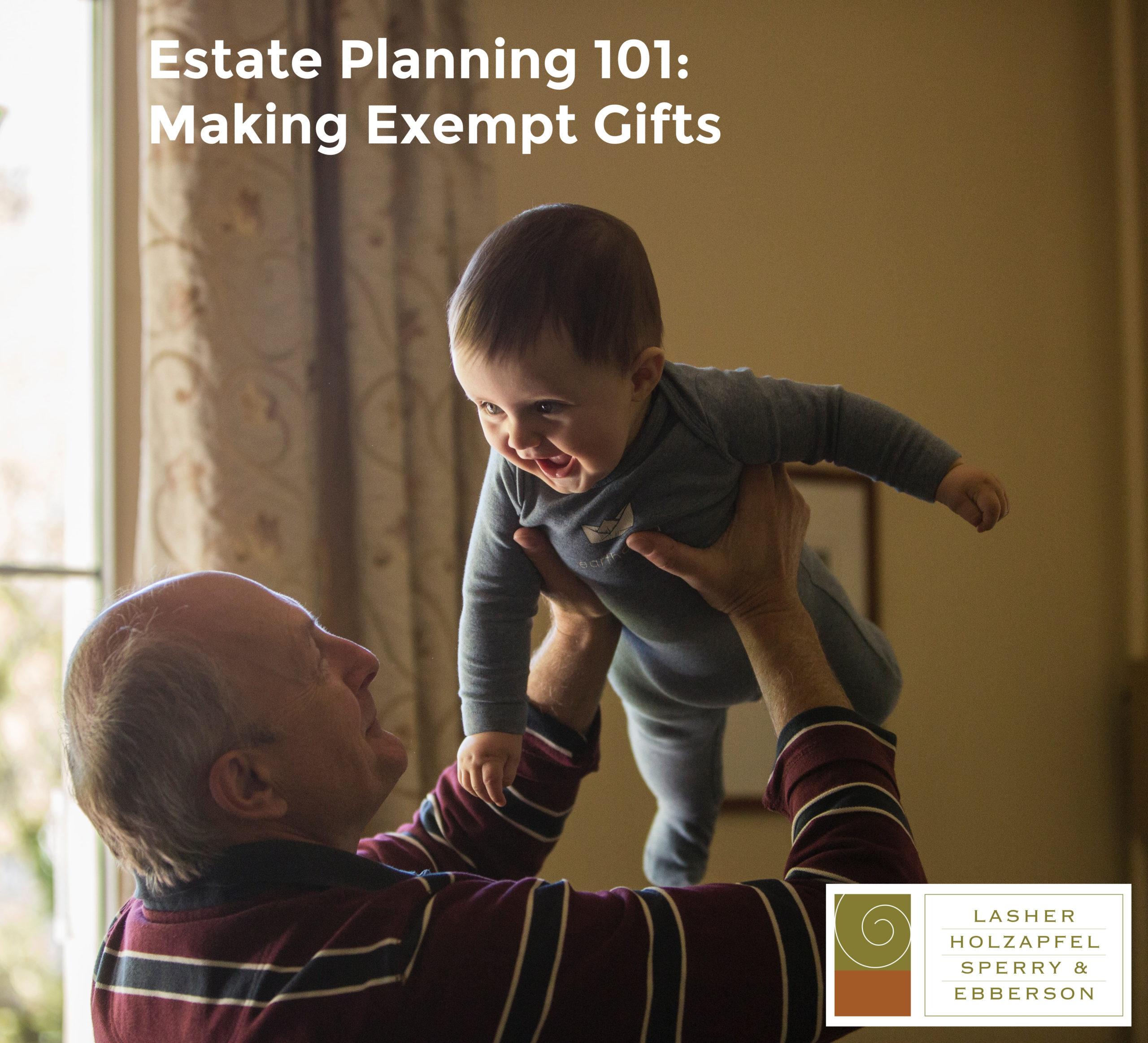 older man holding a baby overhead